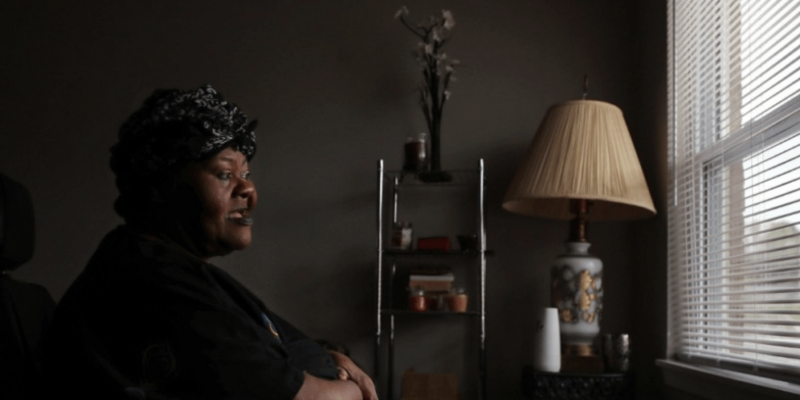 women in dark room